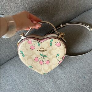 Coach heart shape signature print with cherries.